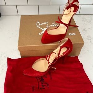 Christian Louboutin red suede pumps